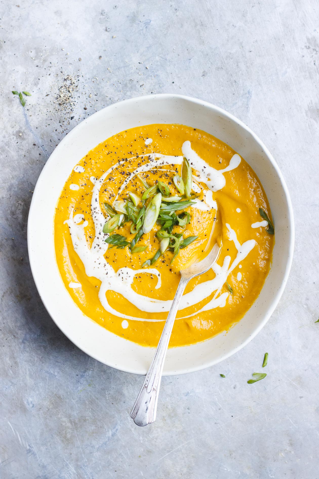 Caramelized Golden Beet Soup with Fall Roots + Garlicky Yogurt | Roasted and deeply caramelized golden beet soup with fall root vegetables and garlicky yogurt or cashew sauce to keep it vegan.