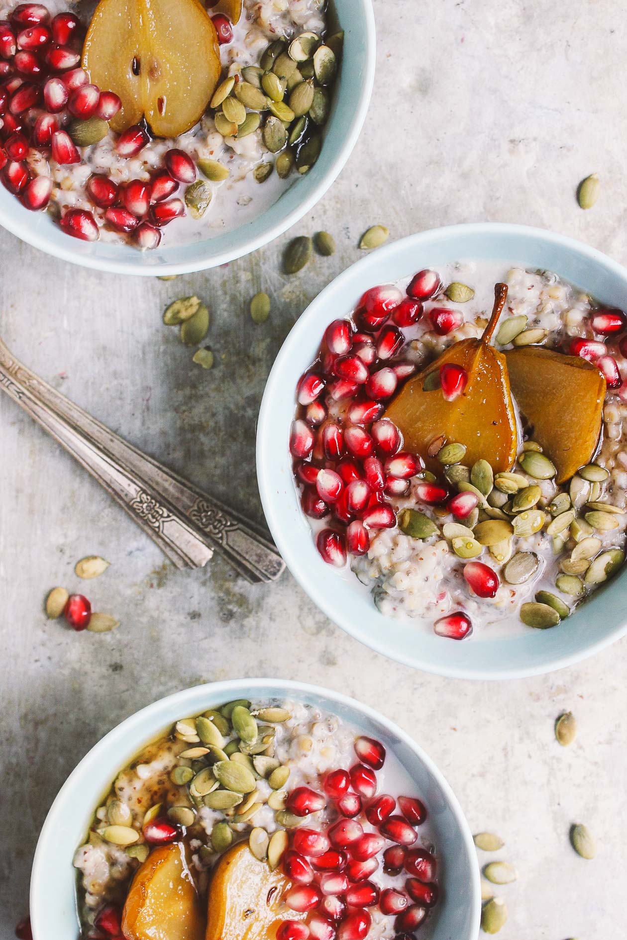Super Seed Steel Cut Oats with Maple Roasted Pears + Pomegranate | Super seed steel cut oats packed with chia and flax and lightly sweetened with maple roasted pears. Oats can be made ahead of time to have on hand all week. 