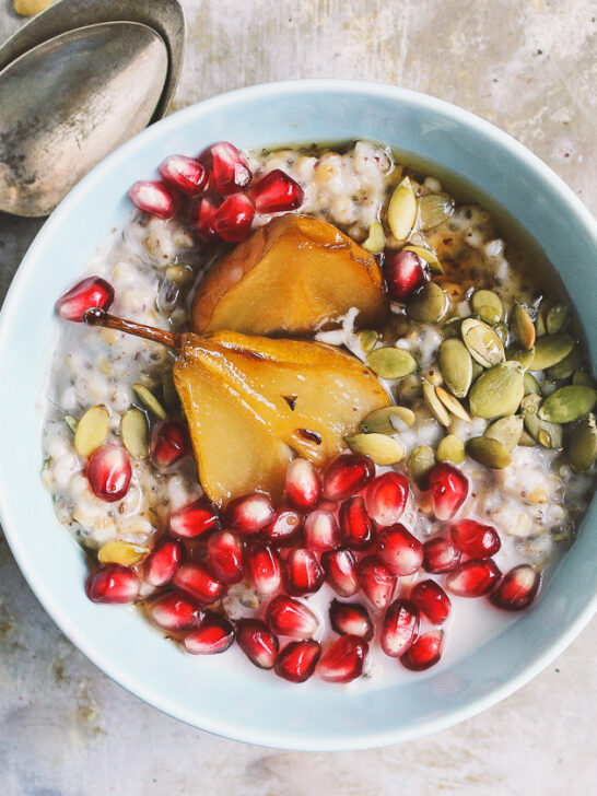 Super Seed Steel Cut Oats with Maple Roasted Pears + Pomegranate | Super seed steel cut oats packed with chia and flax and lightly sweetened with maple roasted pears. Oats can be made ahead of time to have on hand all week.