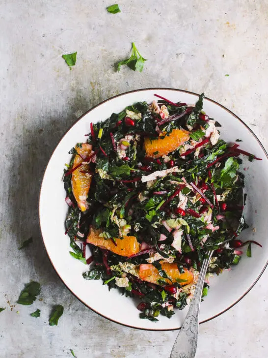 Winter Chopped Kale Salad with Citrus Vinaigrette | Winter chopped kale salad packed with pomegranates and oranges and a zesty citrusy vinaigrette. A hearty, naturally vegan and gluten-free winter kale salad.