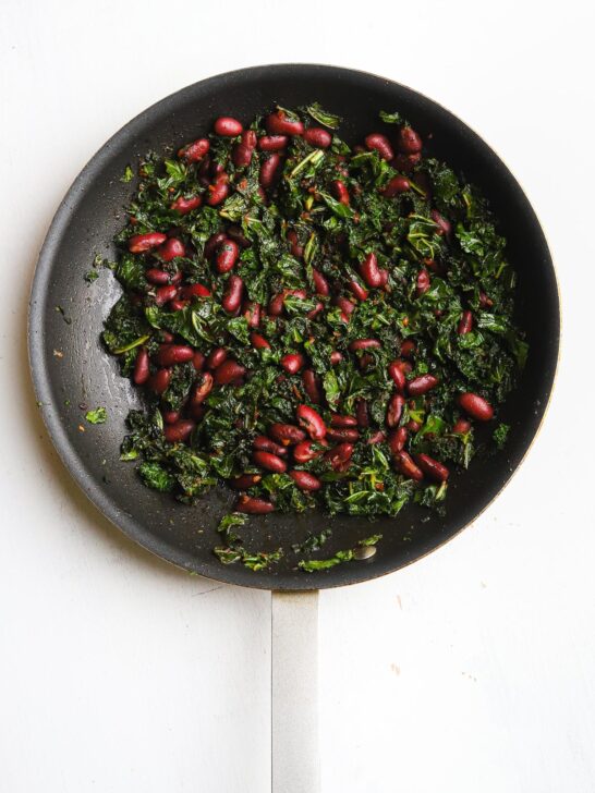 kidney beans and kale in a skillet