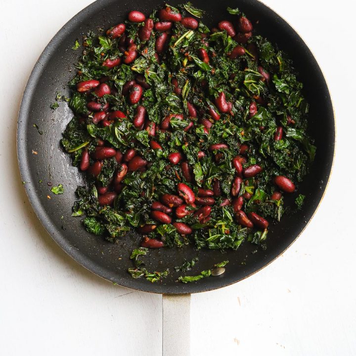 kidney beans and kale in a skillet