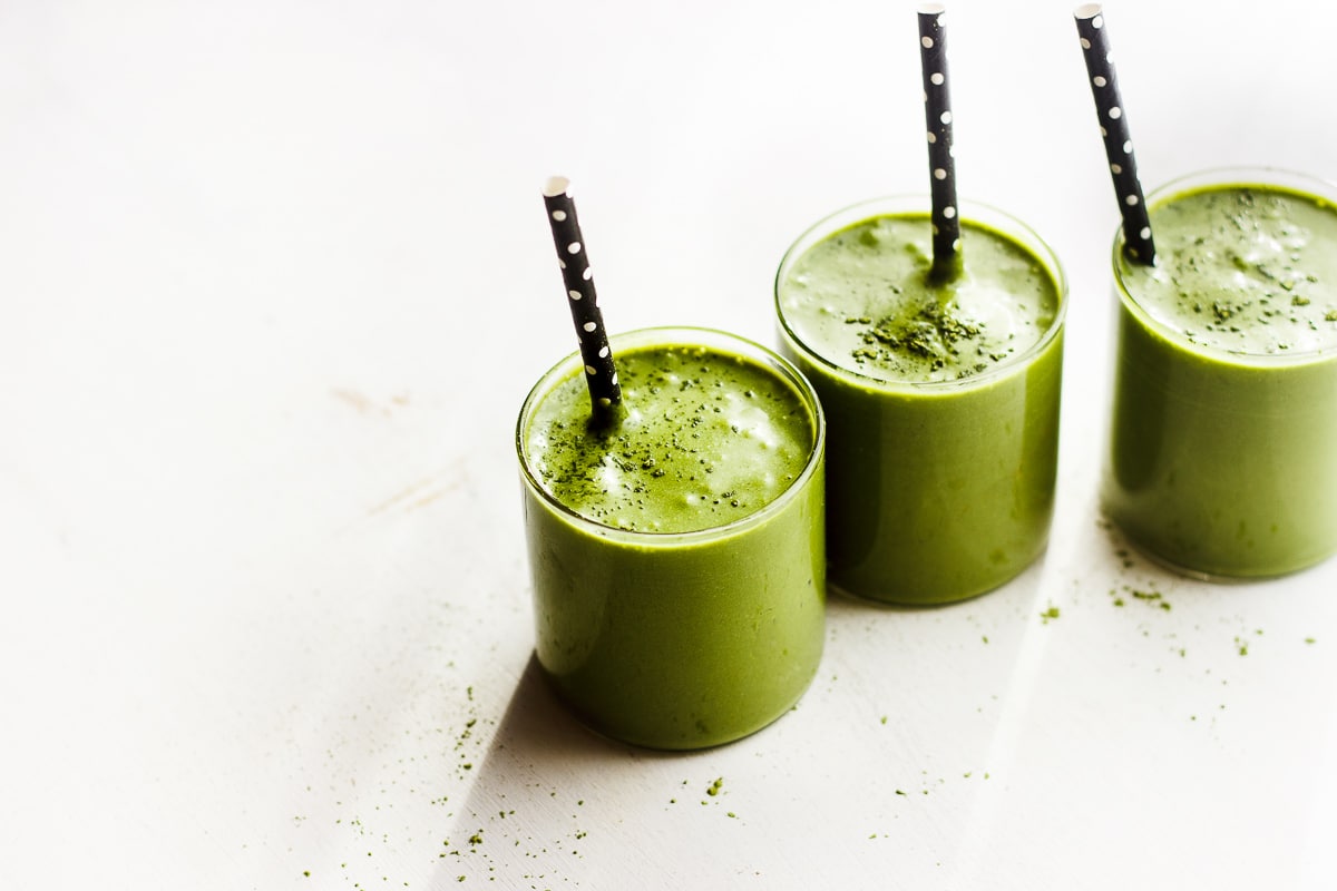 matcha shake in glass with straw