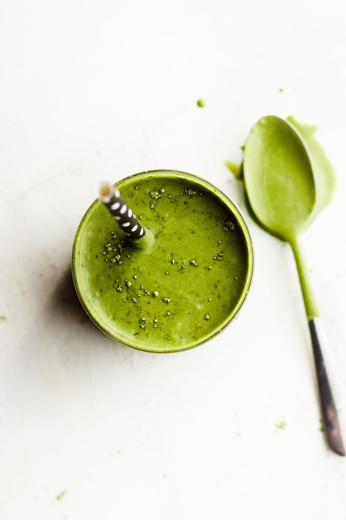 matcha shake in glass with spoon