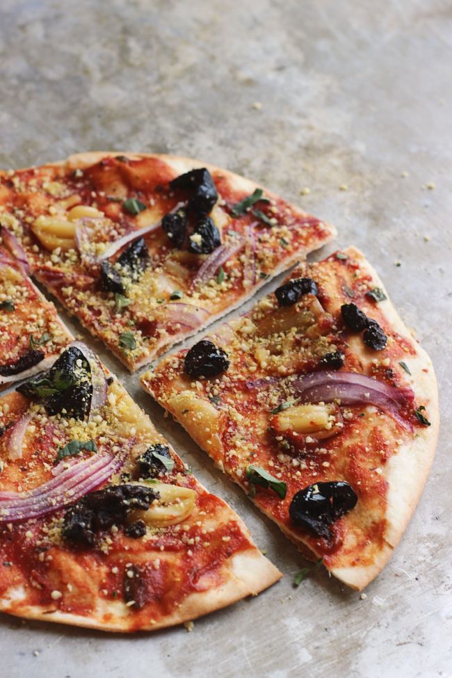 Oil-cured Black Olive + Smashed Garlic Pizza with Herby Oregano ‘Parm’