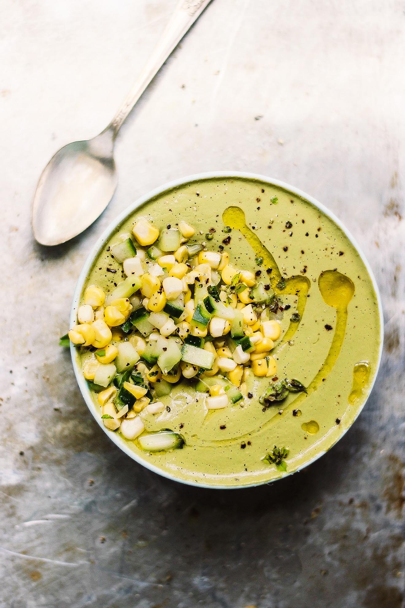 Chilled Cream of Basil Soup with Corn + Cucumber Salad | Cream of basil soup made naturally vegan with raw cashews and herbs. Topped with a fresh, crunchy summer salad of corn and cucumber. Creamy, chilled, summer soup. 