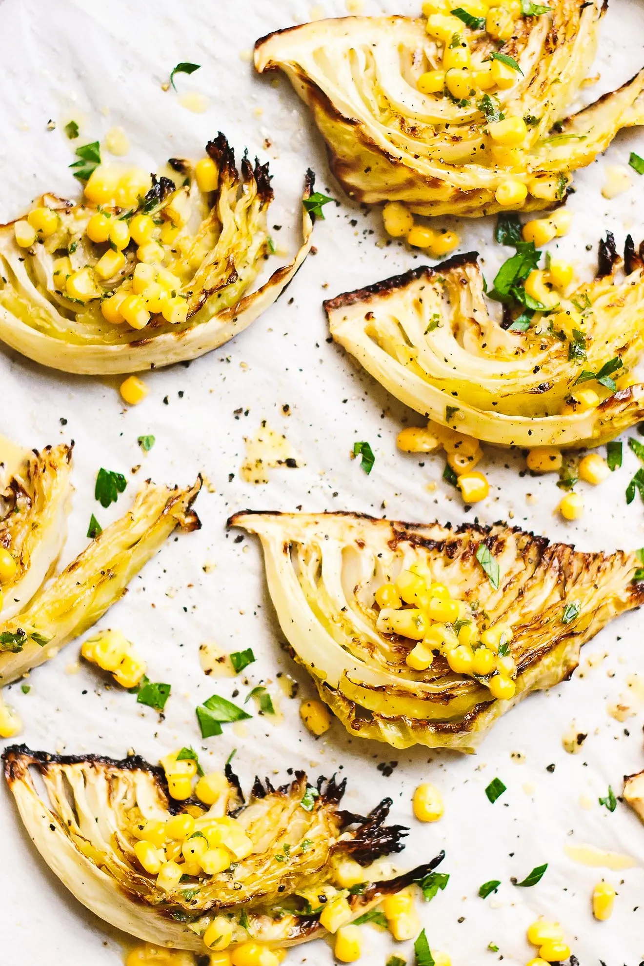 Roasted Cabbage with Sweet Corn + Spicy Vinaigrette | Roasted cabbage wedges with sweet corn and a roasted, spicy vinaigrette is an easy, satisfying summery meal. Naturally gluten-free and vegan. 