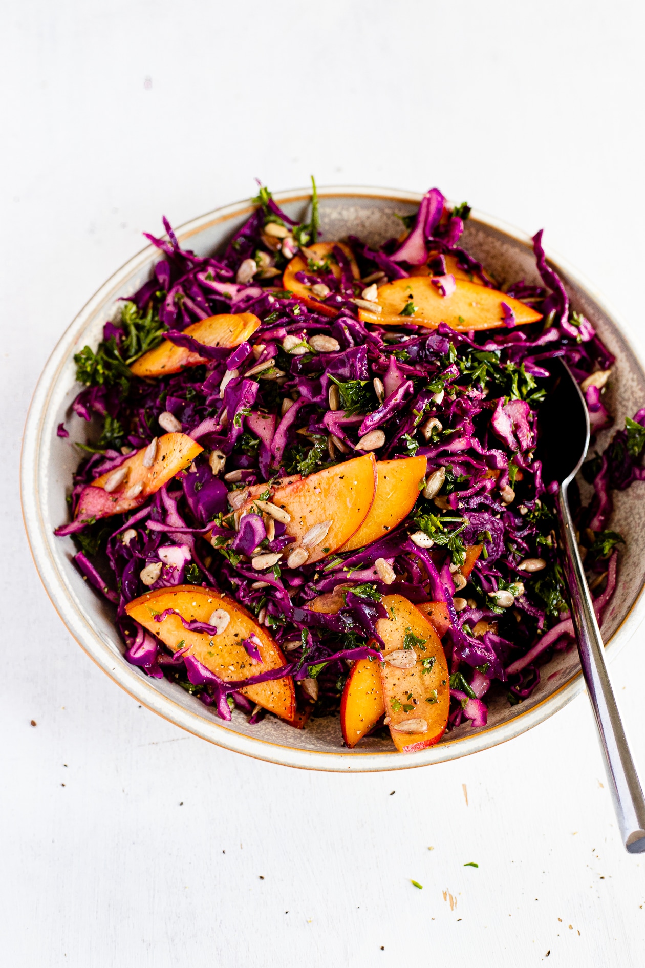 summer slaw in a bowl with sunflower seeds