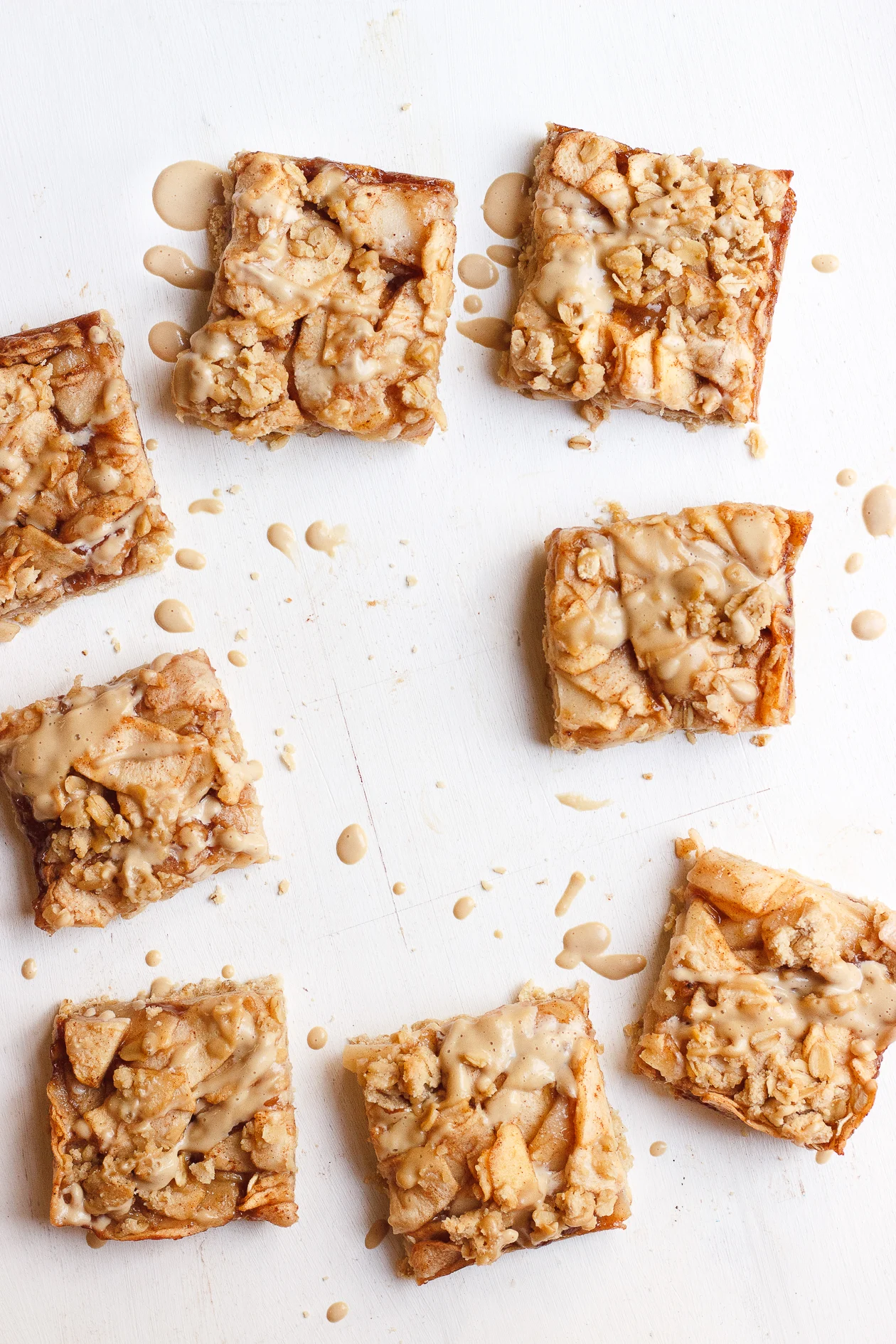 Apple Crumb Bars with Maple Coffee Glaze | These maple-sweetened, gluten-free and naturally vegan, oat apple crumb bars are fancied up with a light drizzle of a maple coffee glaze.