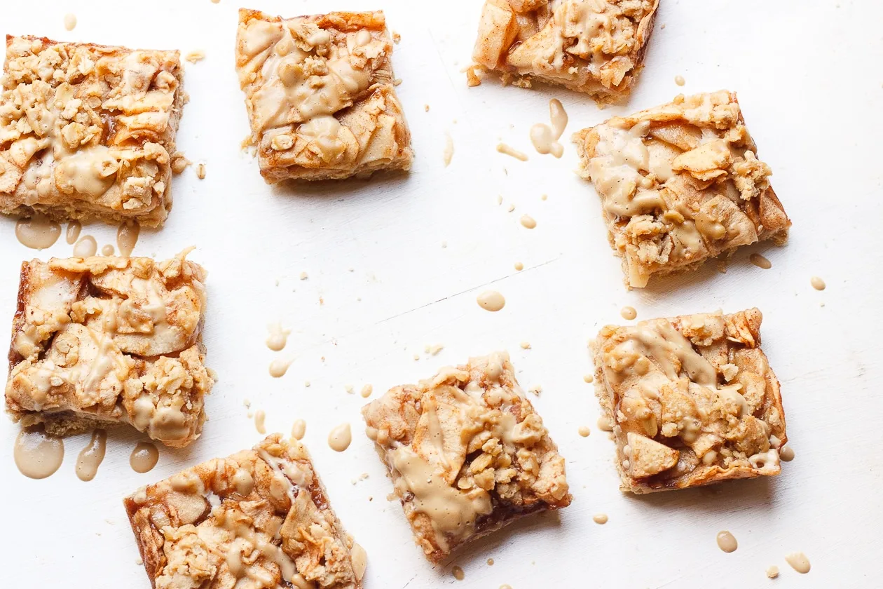 Apple Crumb Bars with Maple Coffee Glaze | These maple-sweetened, gluten-free and naturally vegan, oat apple crumb bars are fancied up with a light drizzle of a maple coffee glaze.