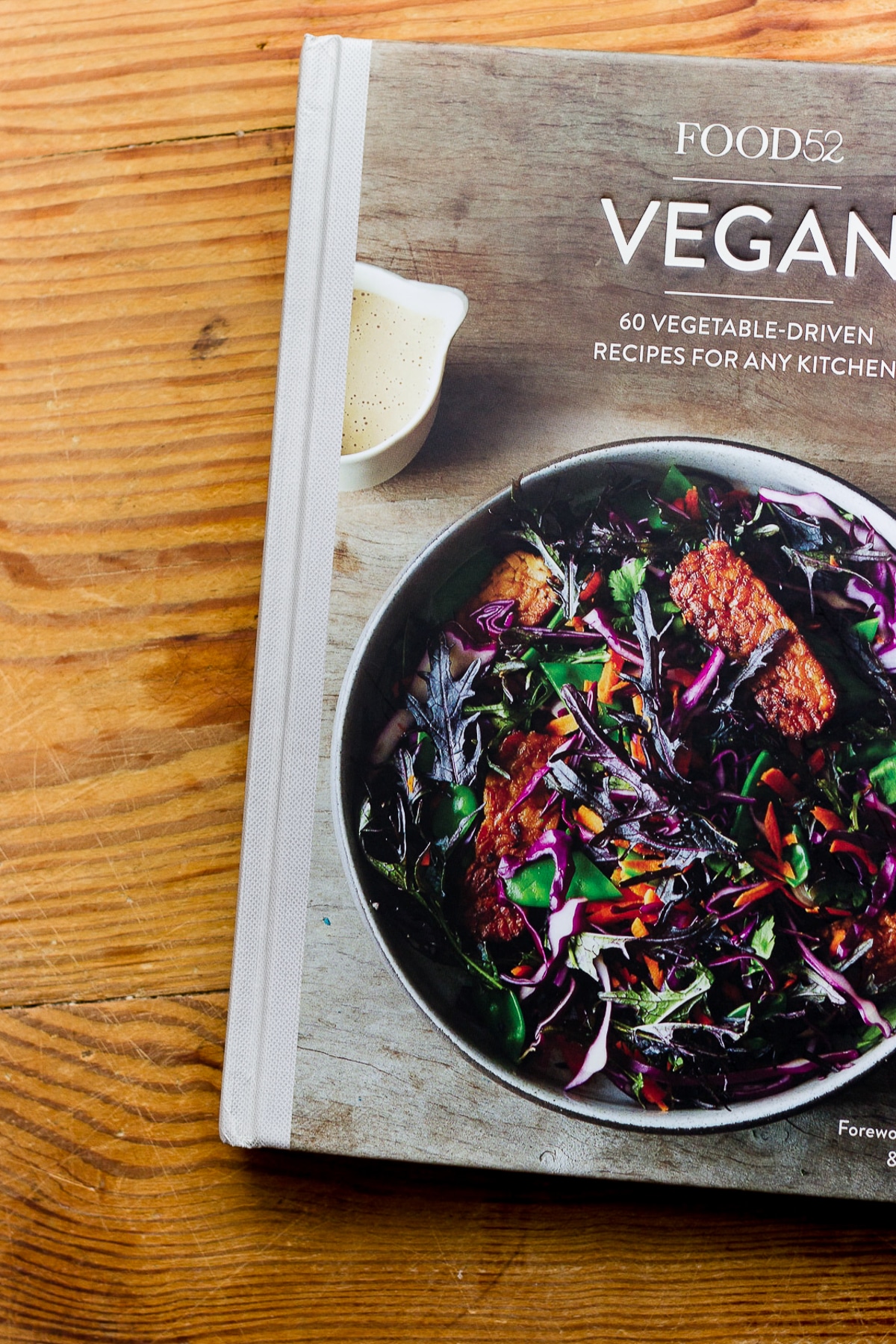Food52 Vegan cookbook on a wooden table