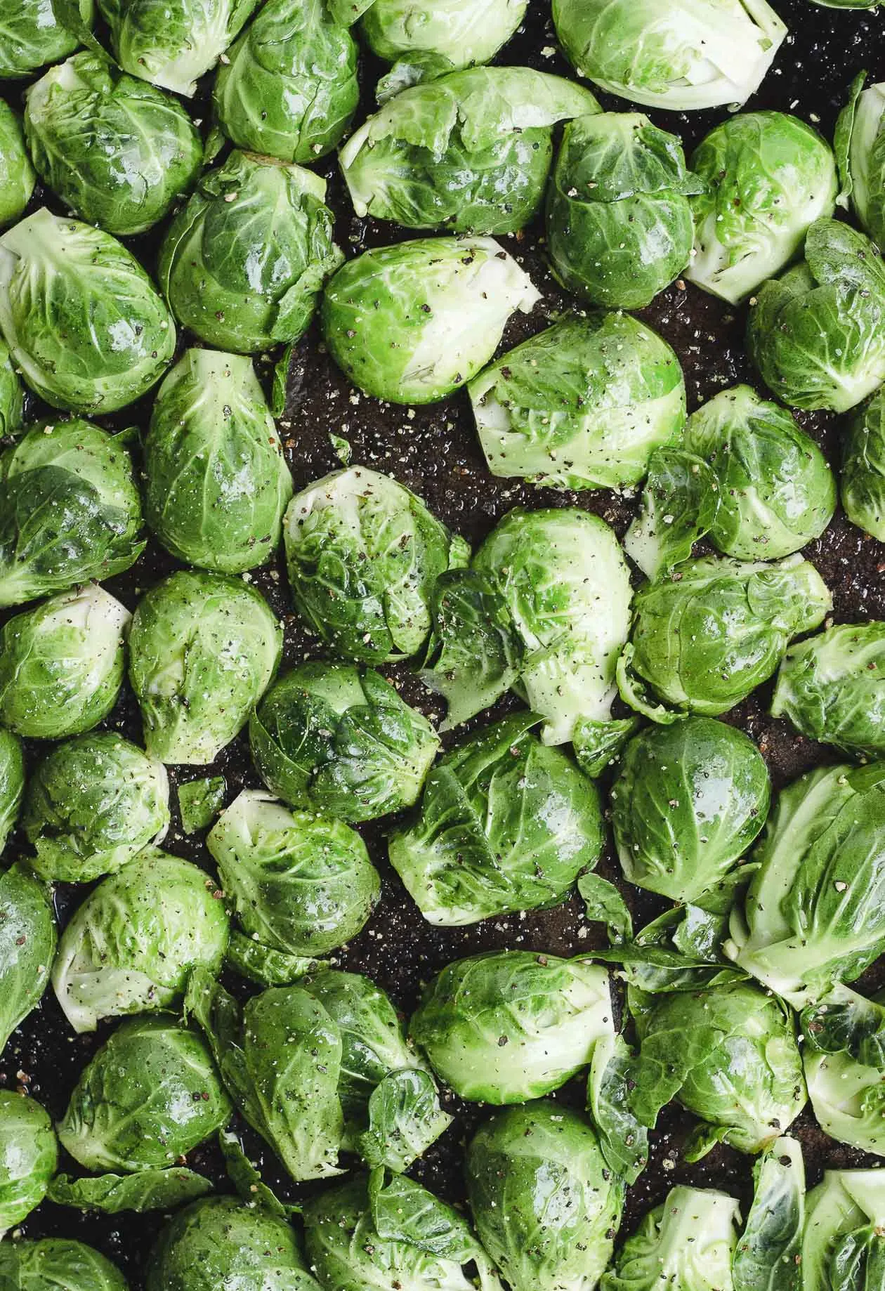 cut brussels sprouts on a sheet pan