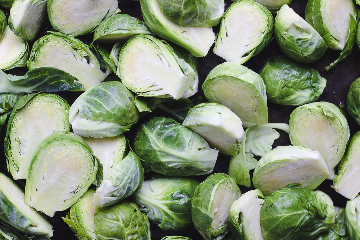 raw brussels sprouts on a sheet pan