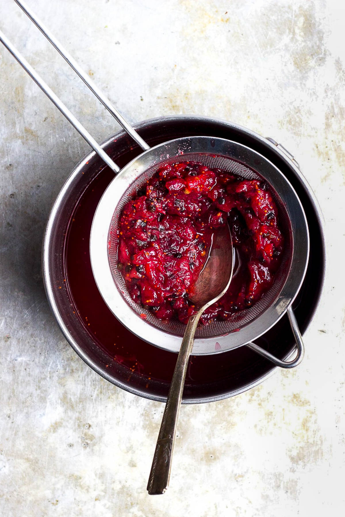 strainer with cranberry sauce