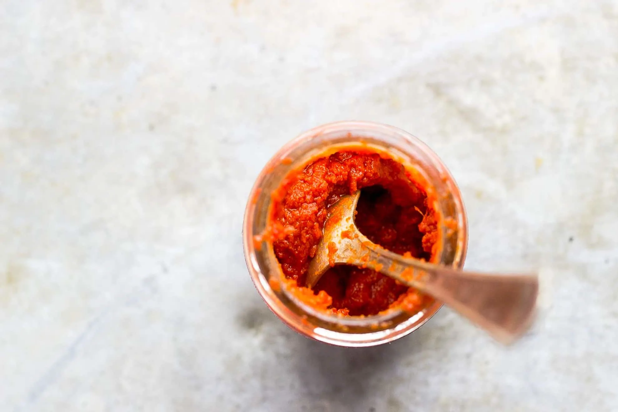 red curry in a jar with spoon