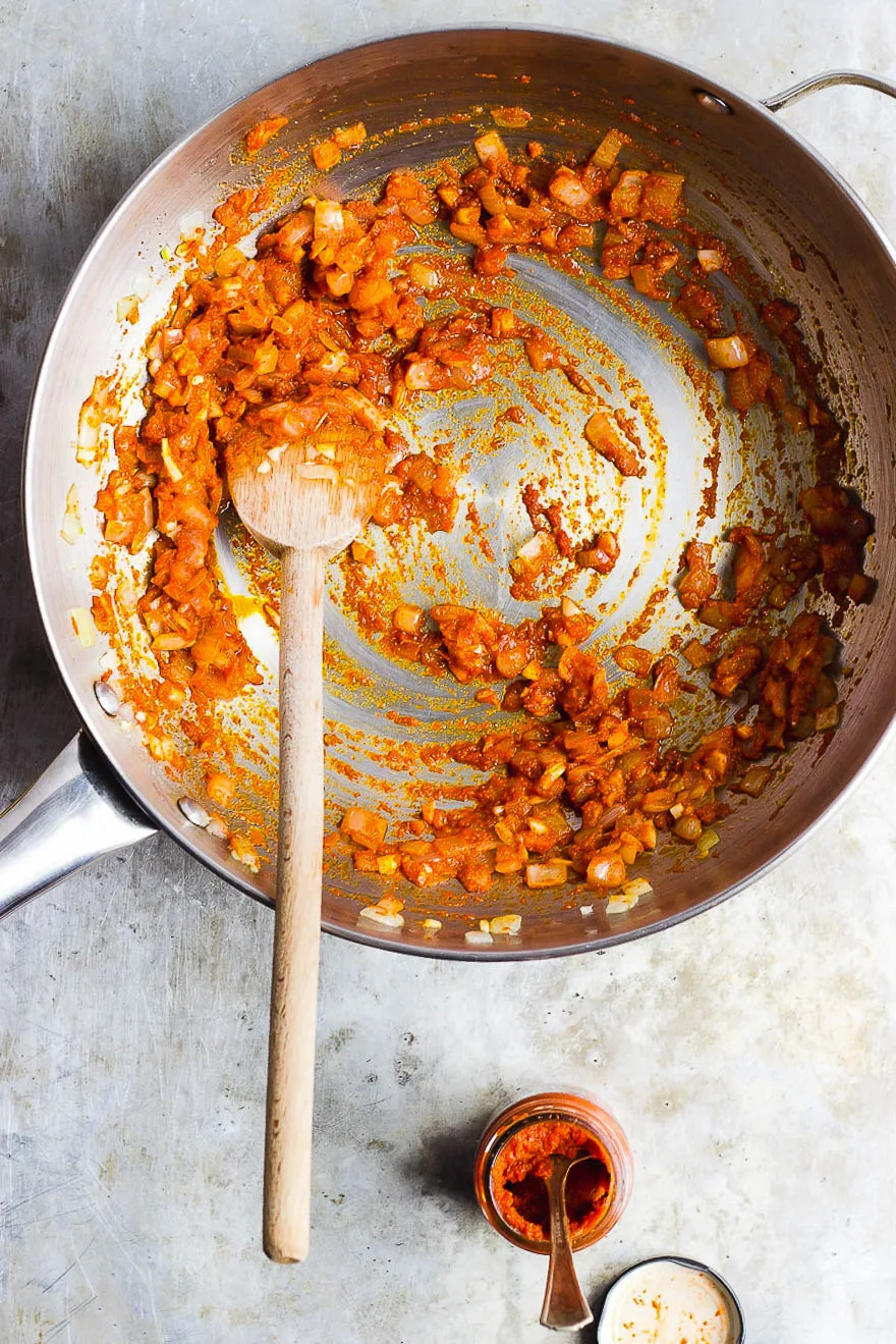 red curry in a pan with spoon