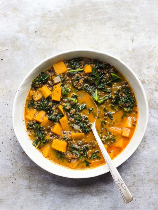 Red Curry Lentil Stew with Butternut Squash + Kale | Red curry lentil stew with butternut squash, kale and creamy coconut milk. It's naturally gluten-free and vegan. It's a hearty fall lentil stew. #butternutsquashrecipes #fallstew #lentilstew