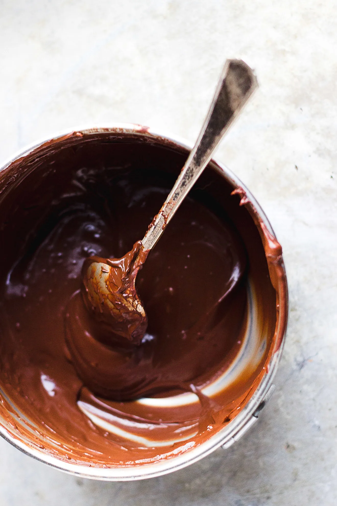 chocolate ganache in a bowl with a spoon