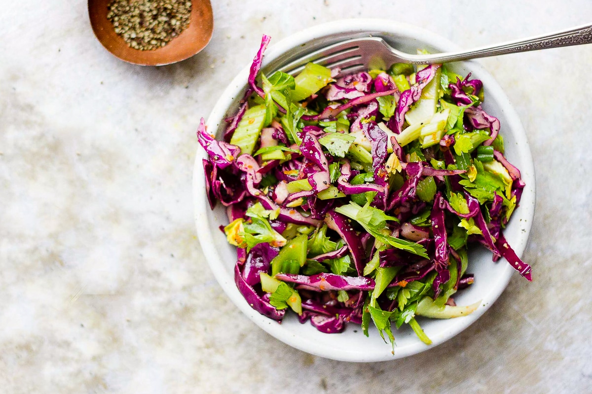 bowl of celery salad with red cabbage