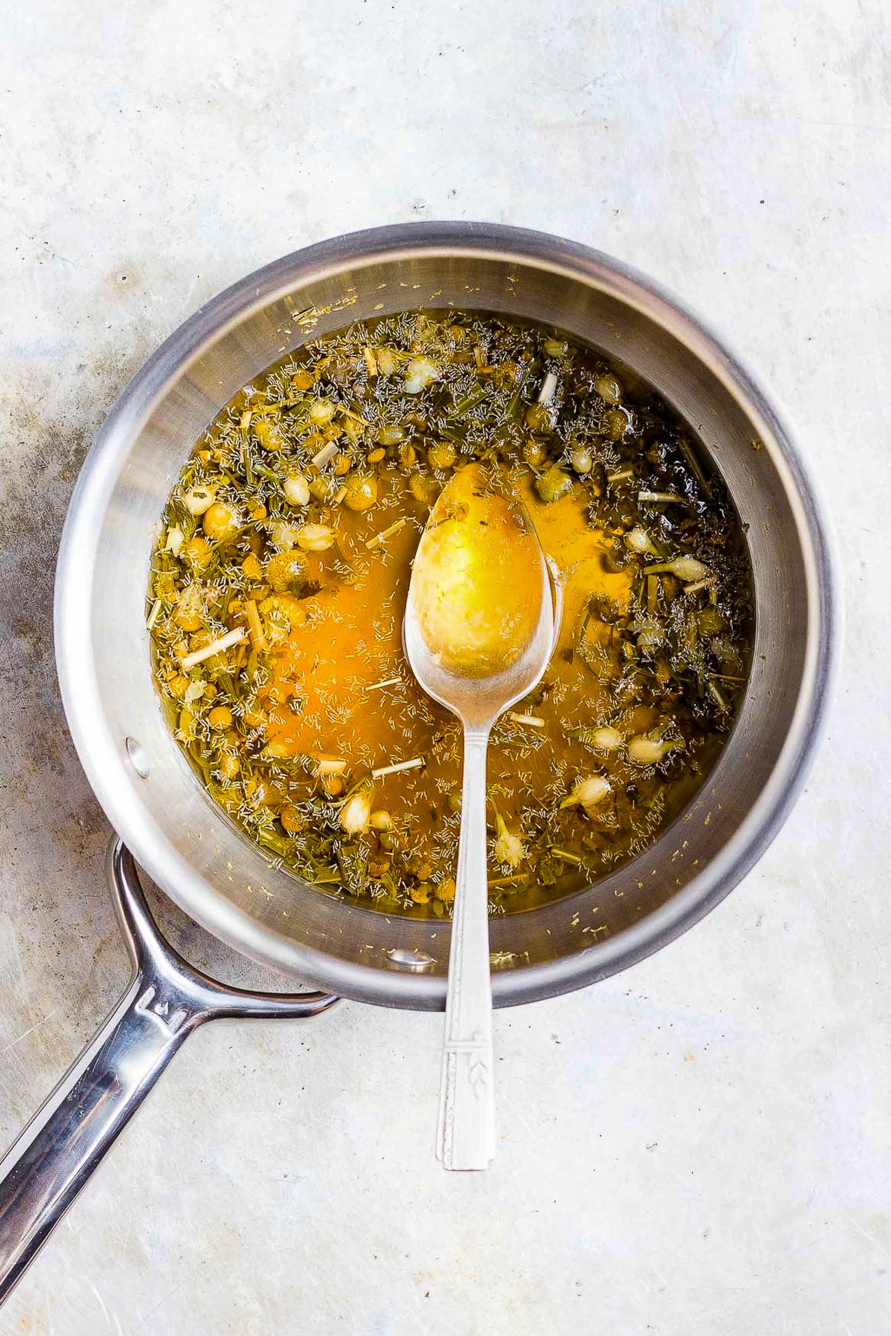 chamomile and honey in a pan
