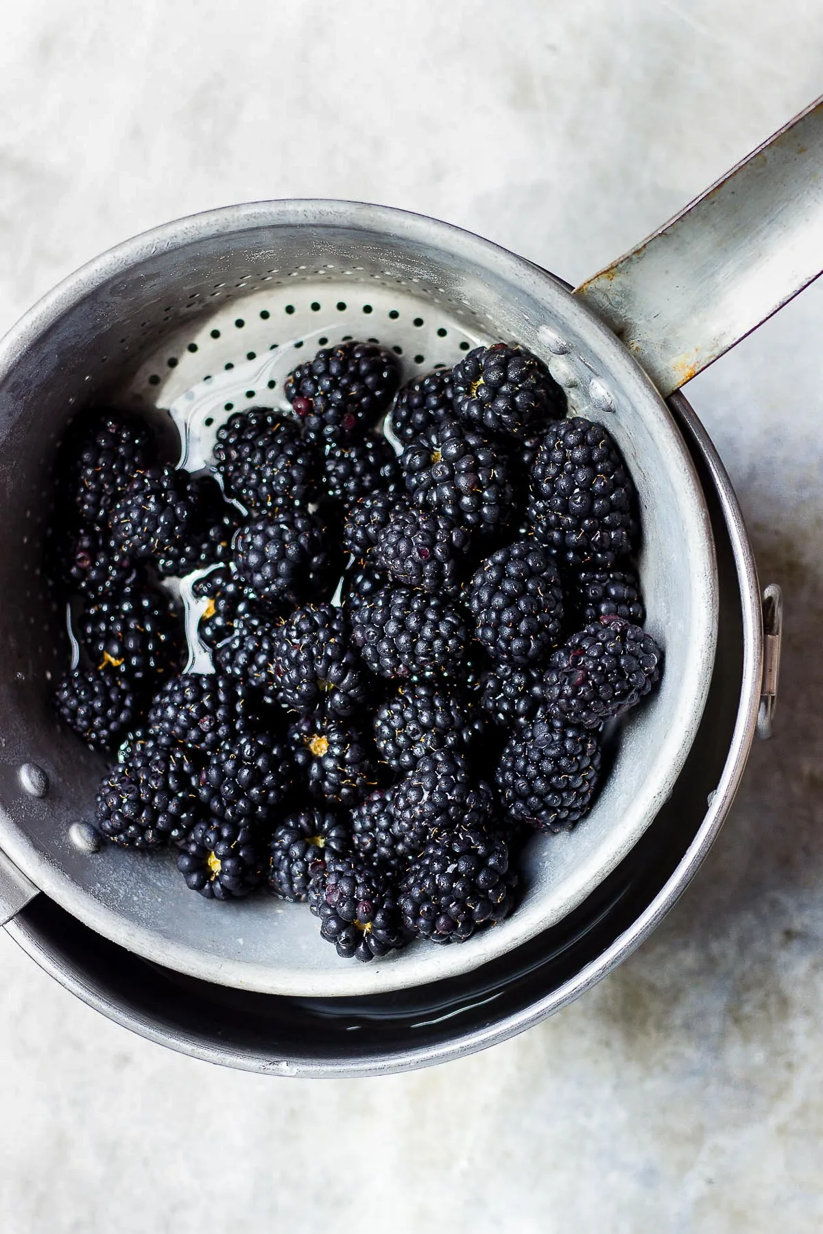 blackberries in a colander