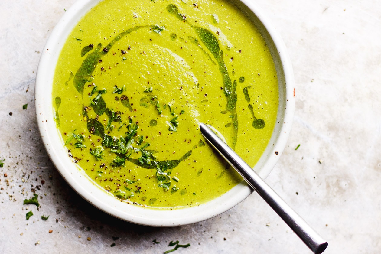 bowl of green tomato soup with herbs