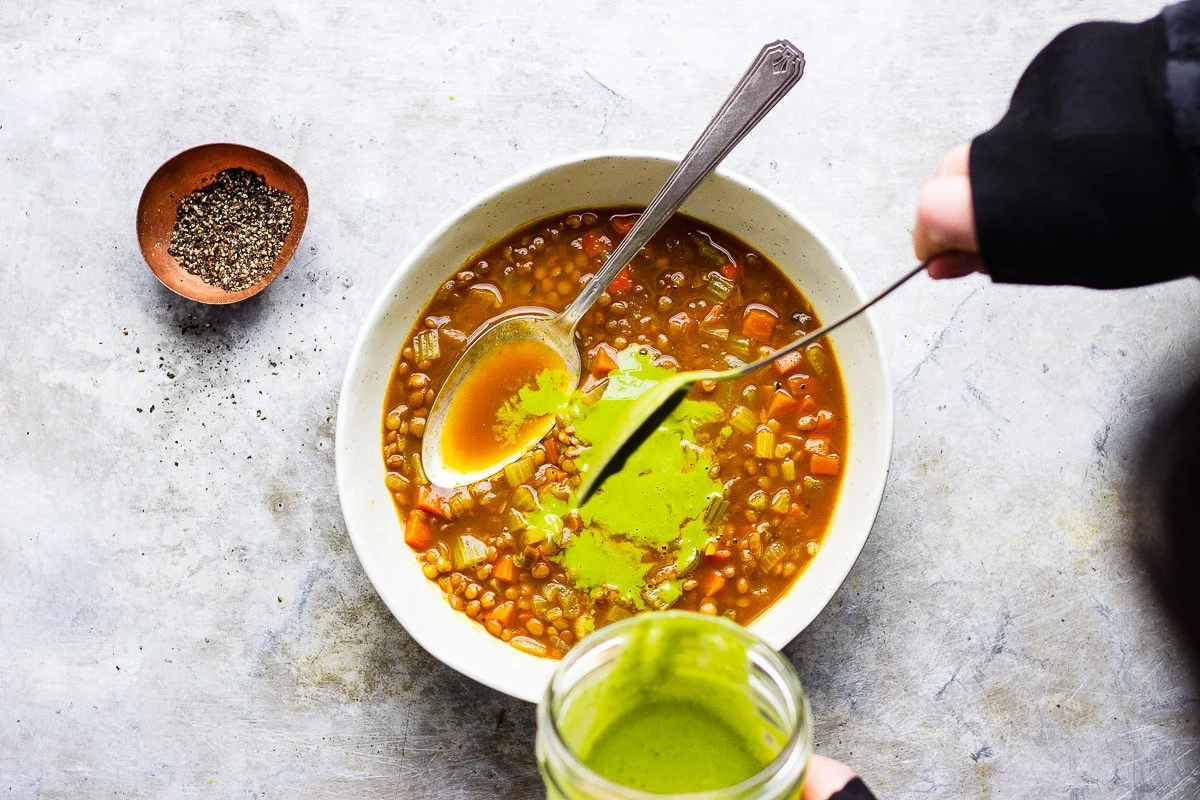 sauce on top of vegan lentil soup