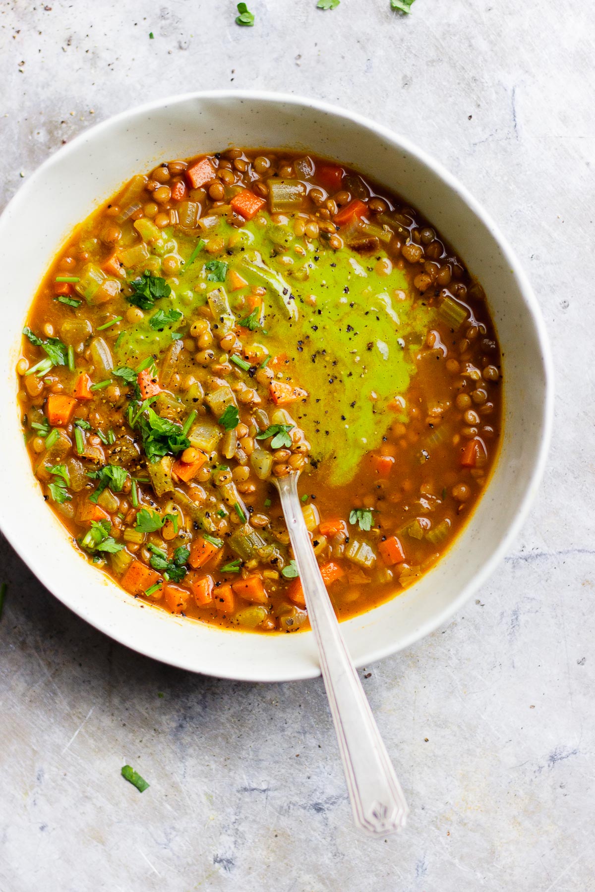parsley sauce on vegan lentil soup