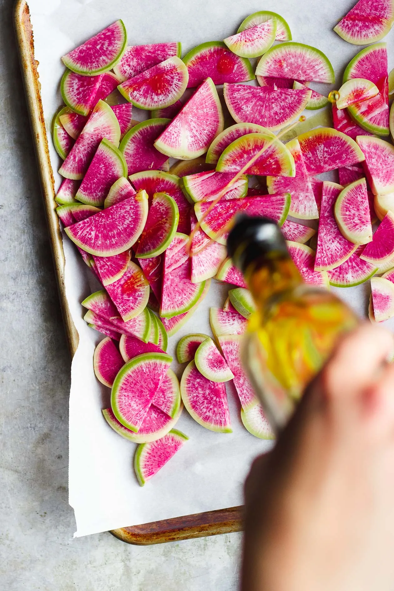 watermelon radishes sliced on sheet pan