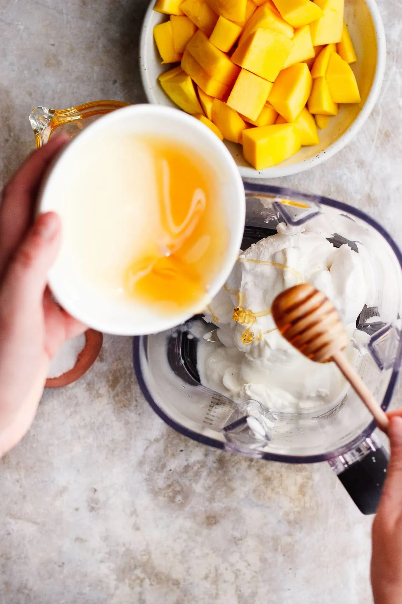 Coconut Mango Milkshake with Honey + Chamomile | A smooth, creamy coconut mango milkshake made from coconut cream and naturally vegan. Infused with chamomile tea and drizzled with honey.