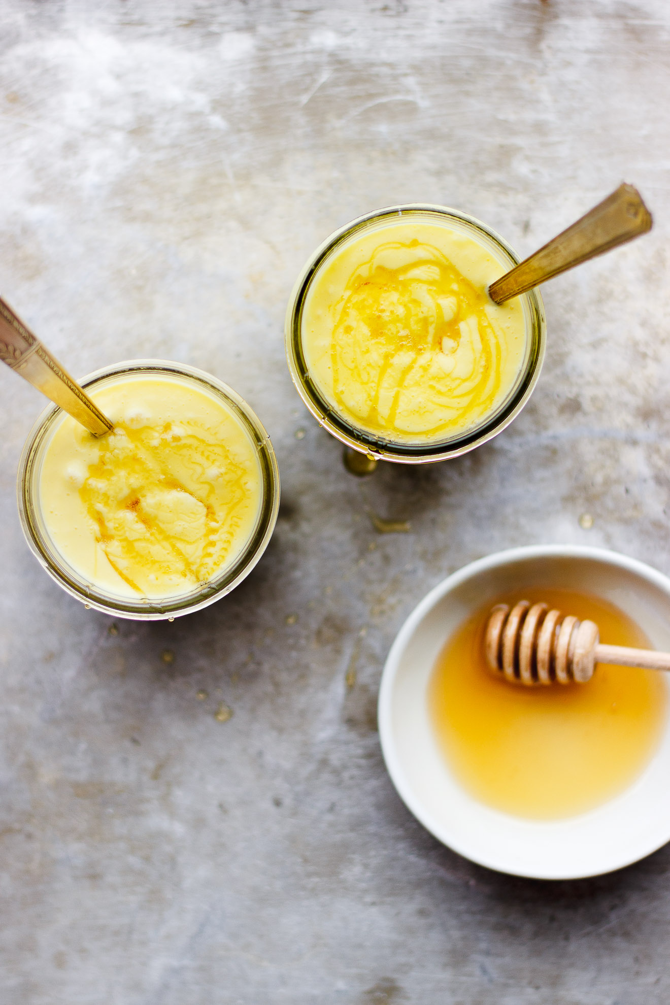 Coconut Mango Milkshake with Honey + Chamomile | A smooth, creamy coconut mango milkshake made from coconut cream and naturally vegan. Infused with chamomile tea and drizzled with honey.