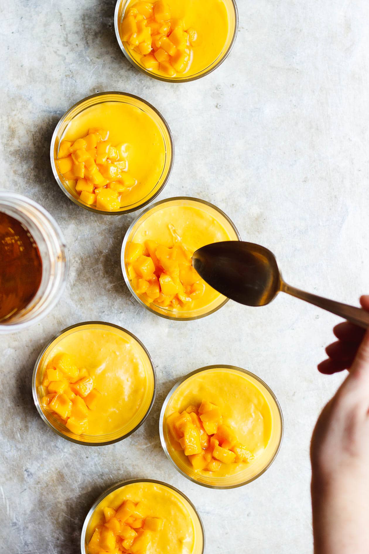 mango pudding in glass ramekins