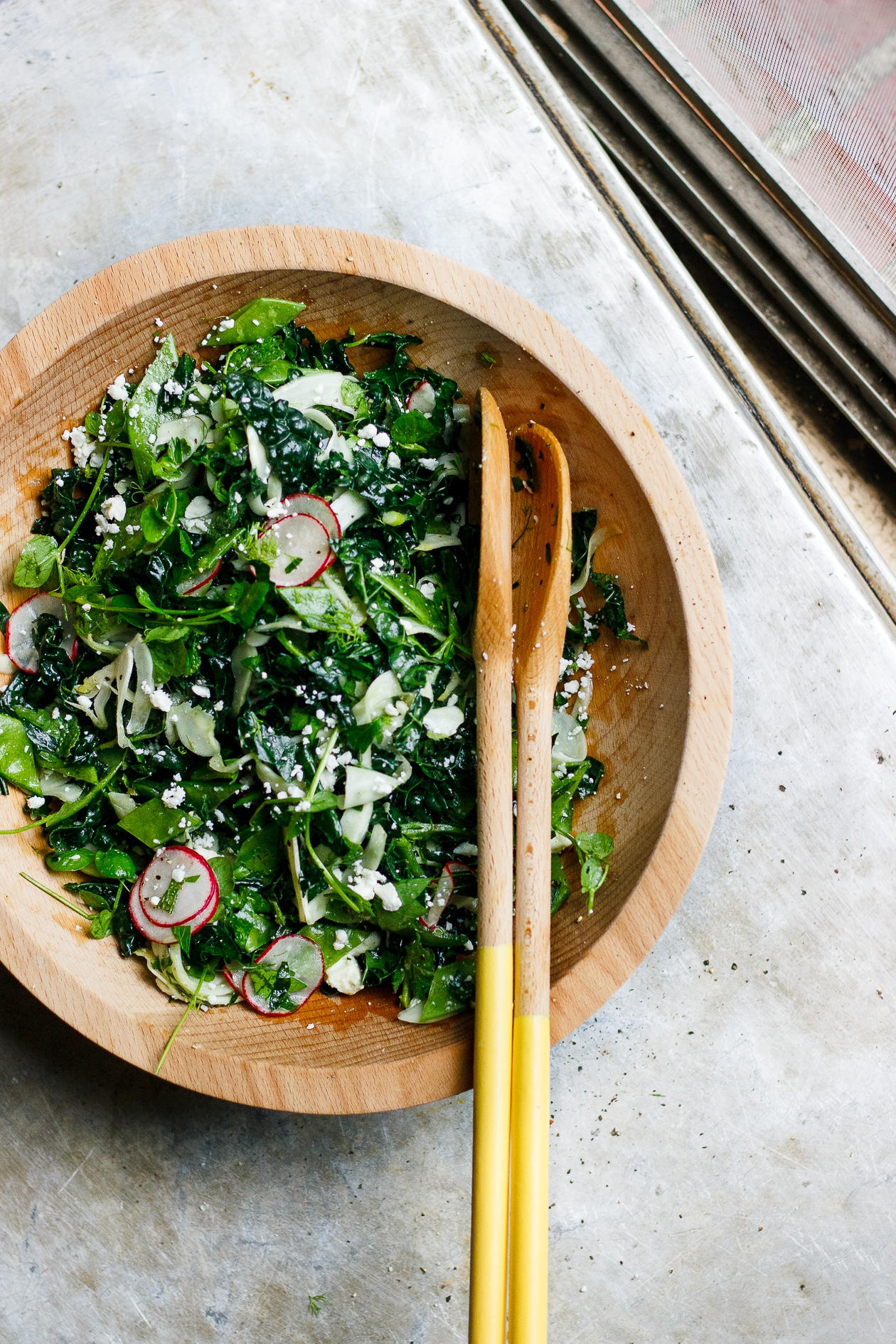 Lemony Fennel Radish + Kale Salad with Herbs + Feta | Lemony fennel, radish, spring pea and kale salad loaded with herbs and feta cheese. A bright, vibrant, packed with flavor spring and summer salad. 