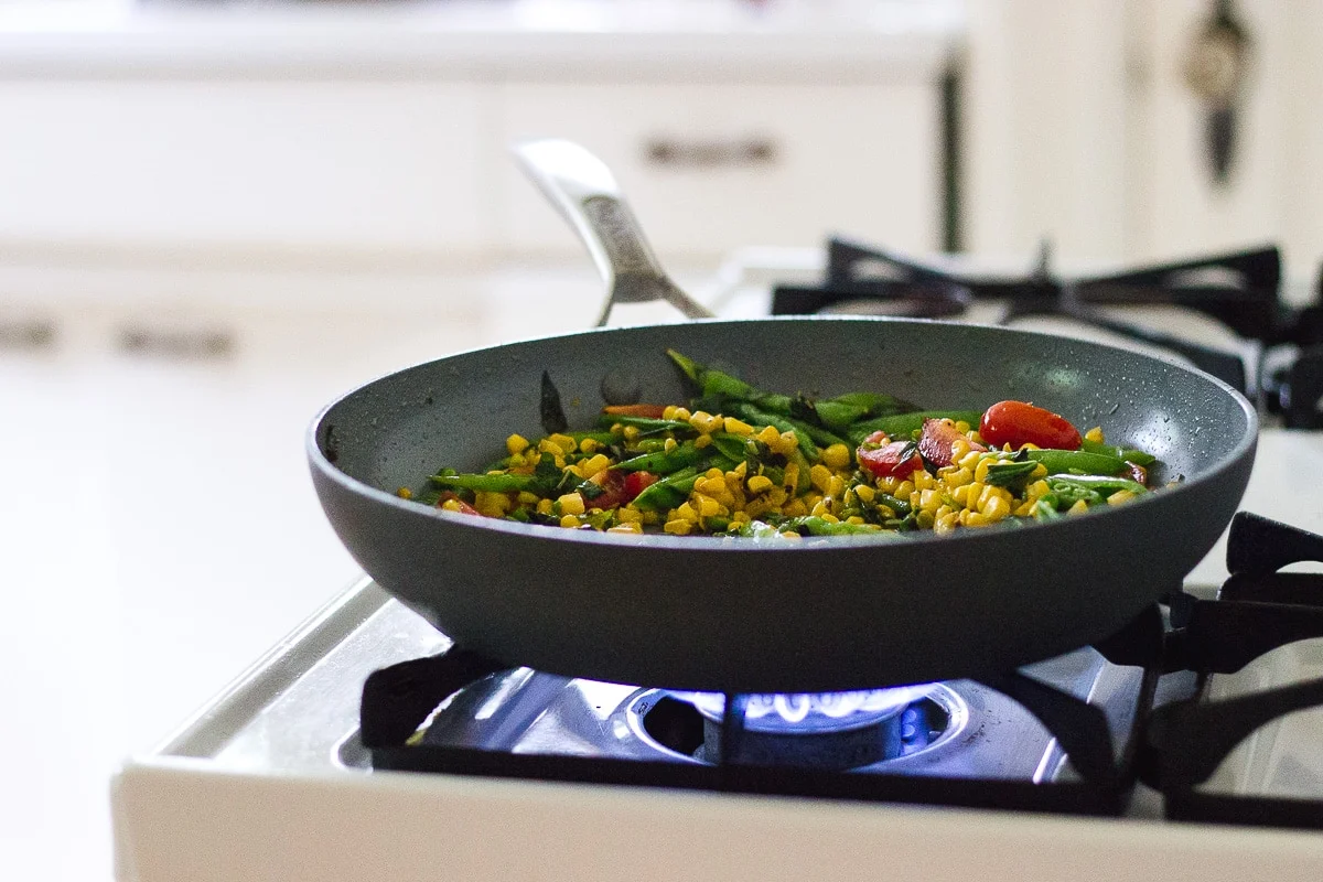 vegetables sautéing on the stove