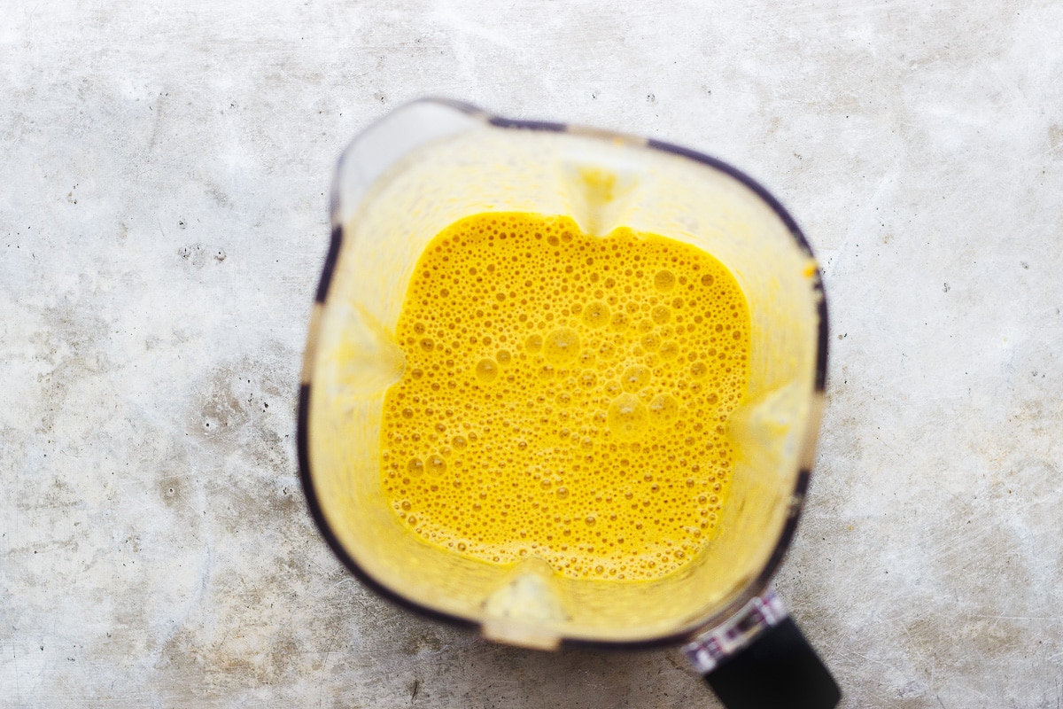 yellow soup in a blender