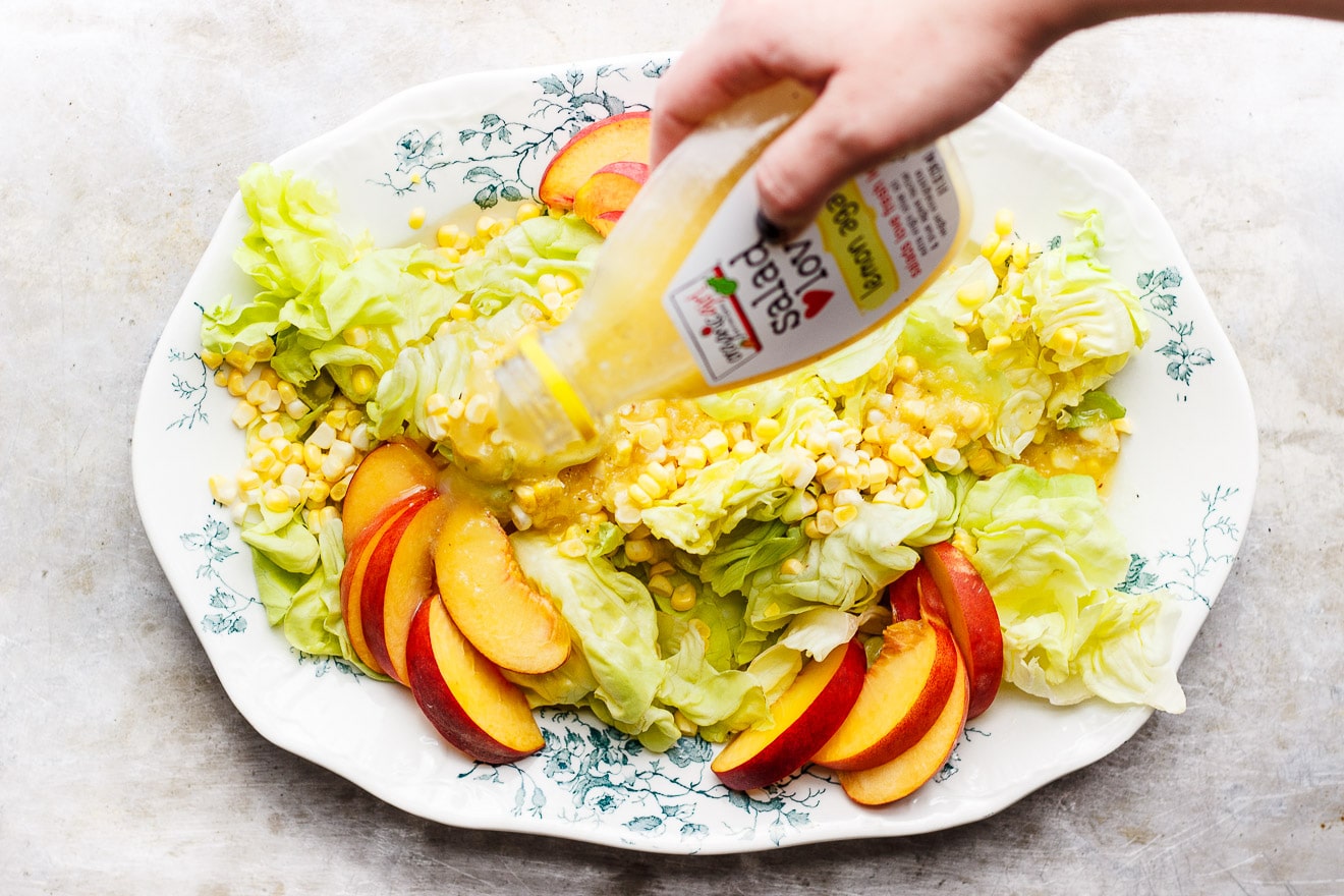 Summer Butter Lettuce Salad with Peaches + Sweet Corn | A fresh, summery, delicate butter lettuce salad with peaches, sweet corn and a light lemon agave dressing. An easy salad with loads of flavor and crunch. 