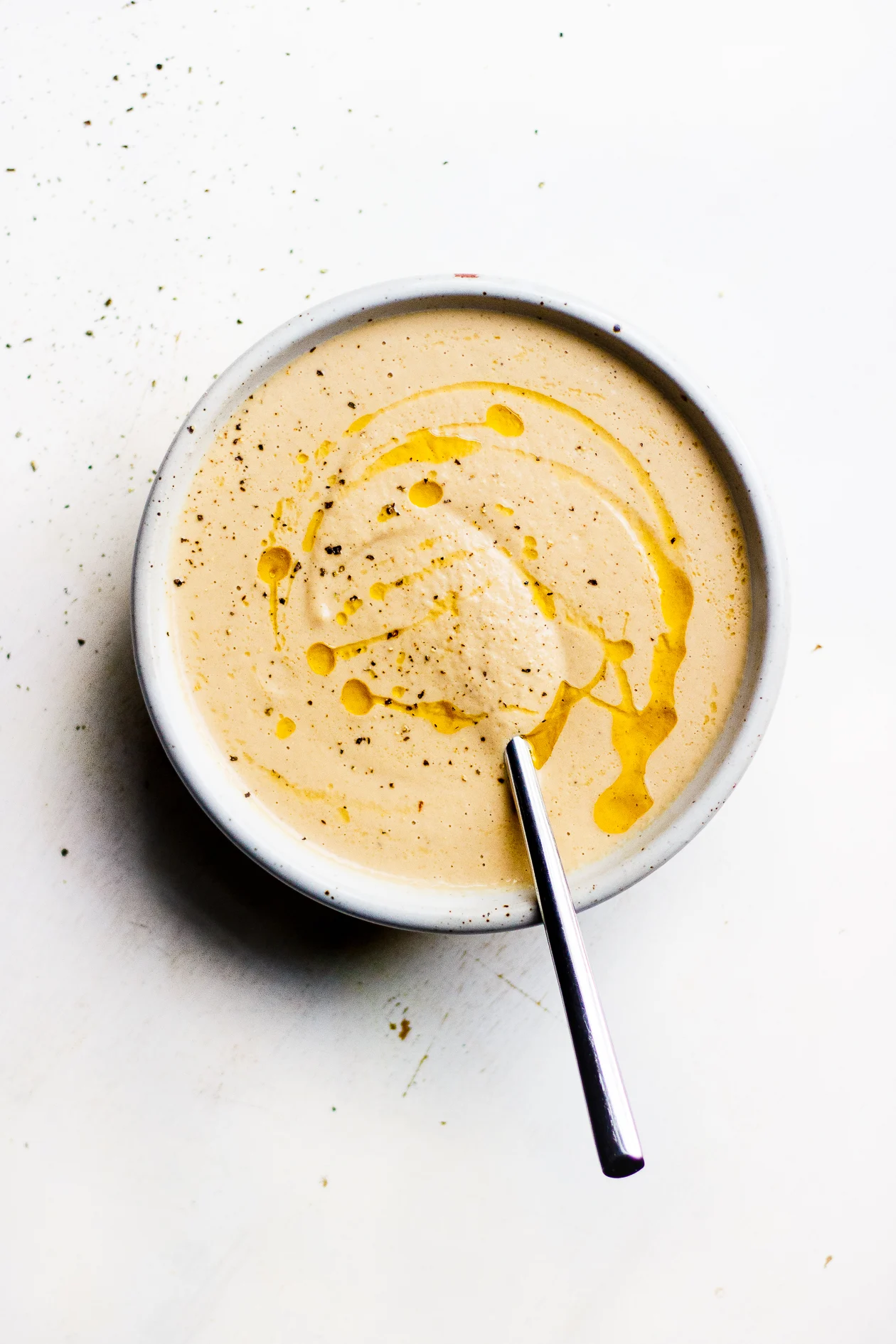 bowl of creamy onion and fennel soup with spoon