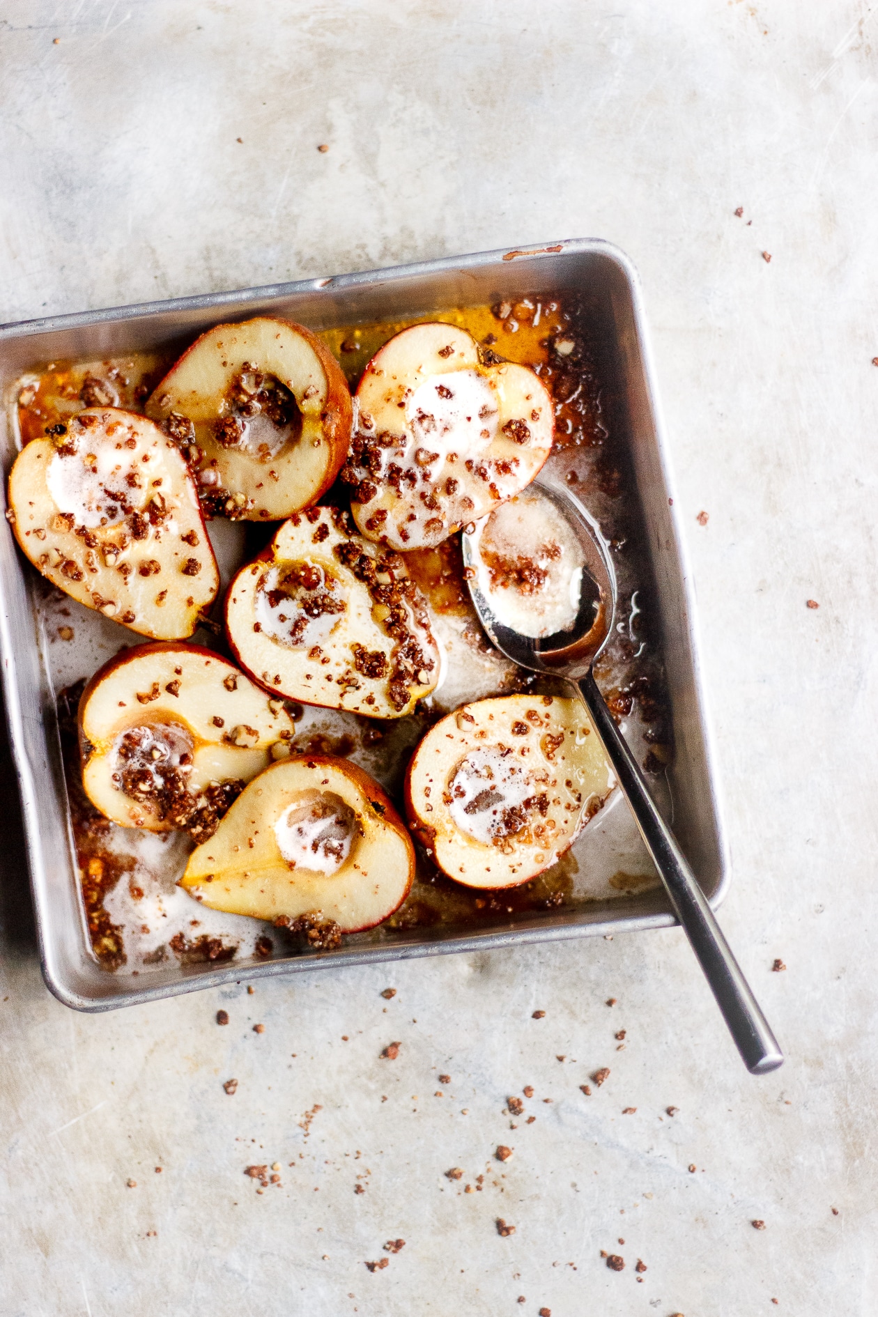 Maple Baked Pears with Chocolate Crumble + Coconut Cream | Maple baked pears with an easy crispy, chocolaty crumble topping. A vegan, refined sugar-free, gluten-free fall pear dessert.