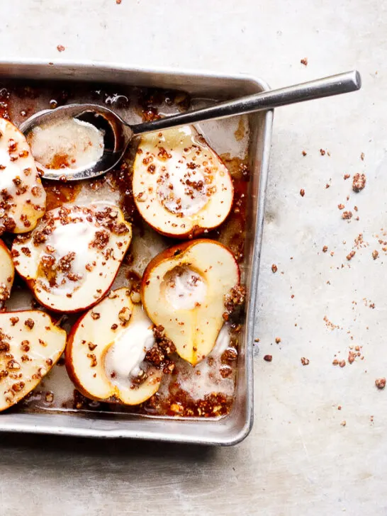 Maple Baked Pears with Chocolate Crumble + Coconut Cream | Maple baked pears with an easy crispy, chocolaty crumble topping. A vegan, refined sugar-free, gluten-free fall pear dessert.