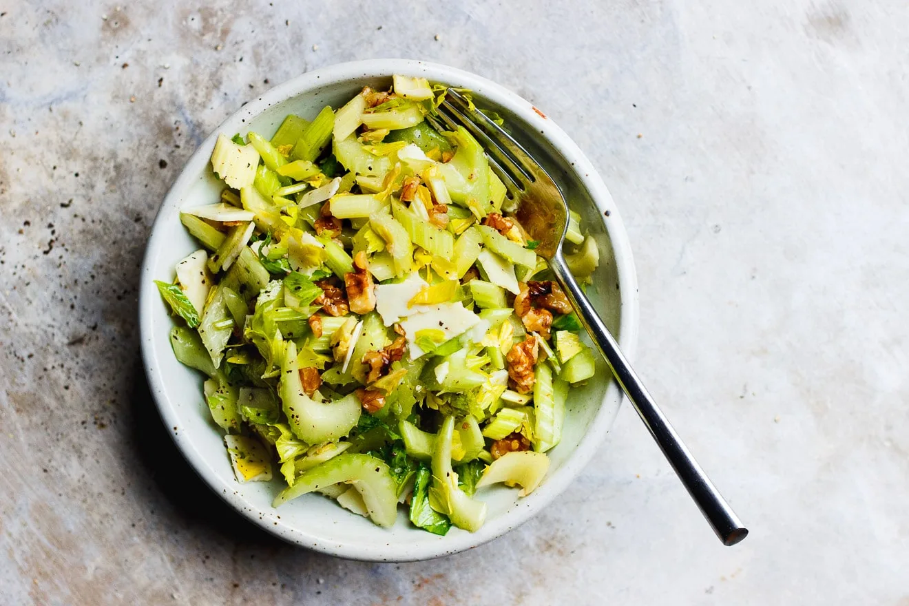 Celery Salad with Parmigiano-Reggiano + Walnuts | A salty, crunchy celery salad with parmigiano-reggiano and walnuts. A classic, three-ingredient celery and parmesan cheese salad.