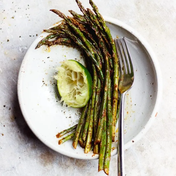 mexican asparagus in a bowl with lime