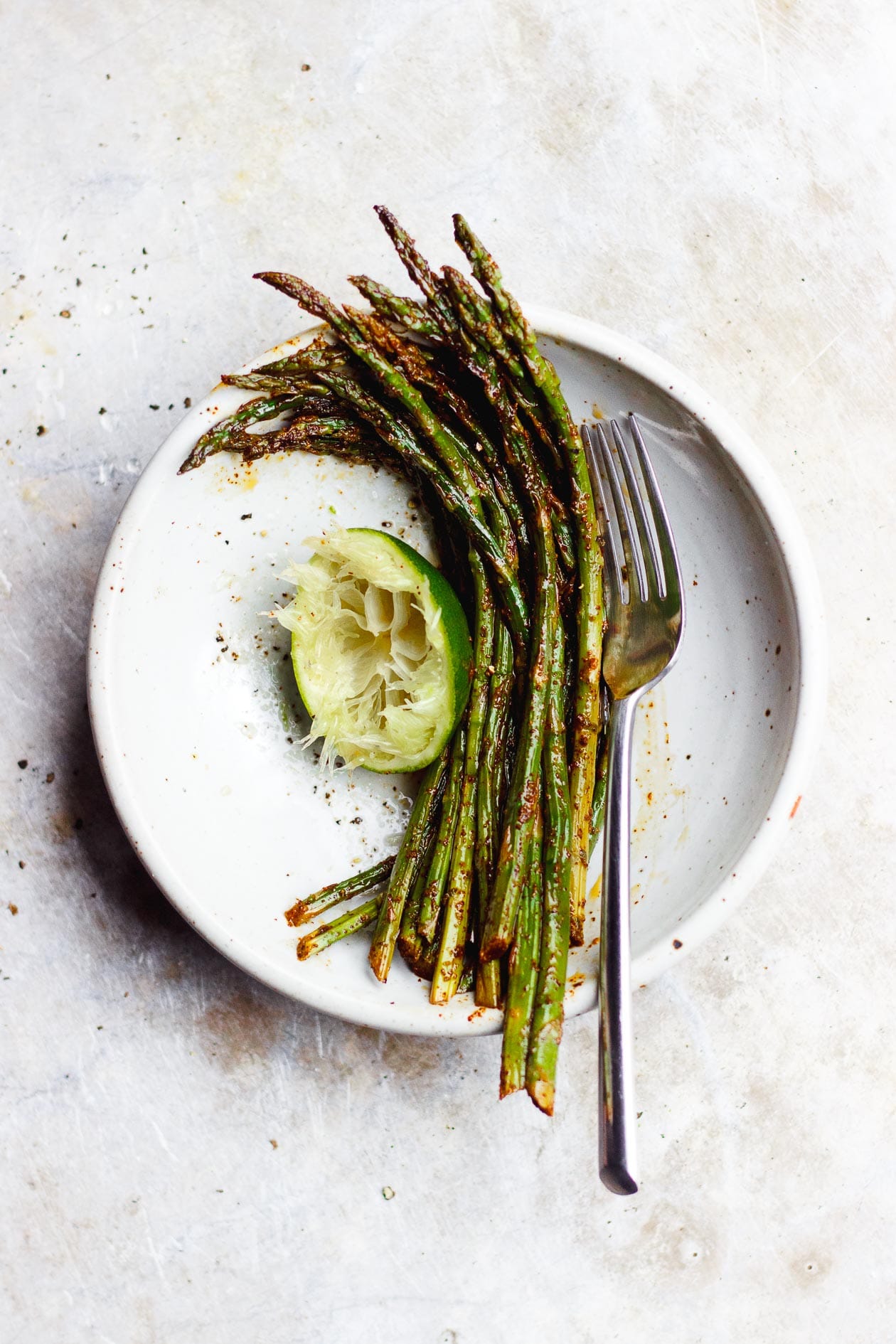 mexican asparagus in a bowl with lime