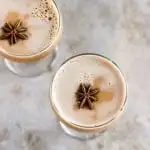 A dirty chai martini naturally sweetened with maple and balanced with a pinch of pink Himalayan salt. Made creamy with almond milk for a vegan cocktail. #dirtychaimartini #dirtychai #espressomartini