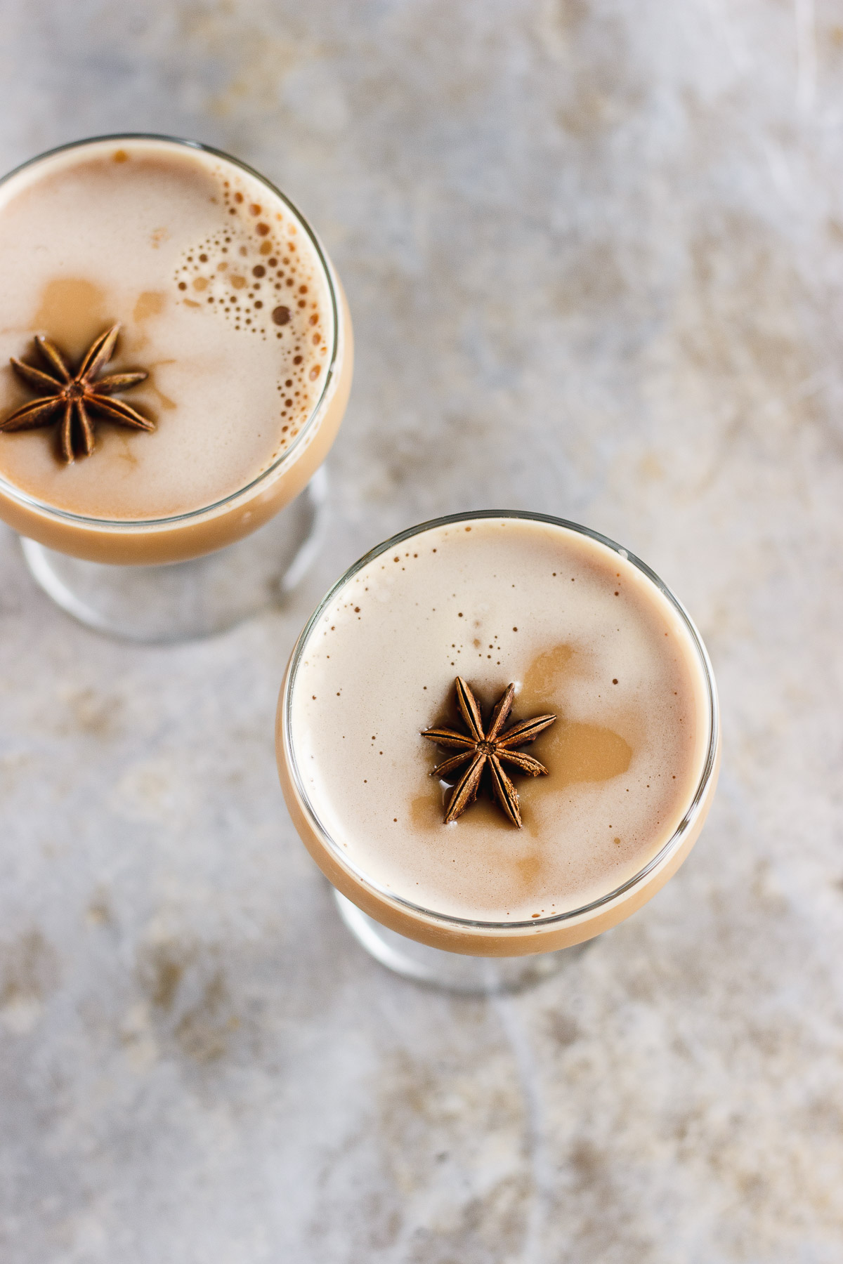 A dirty chai martini naturally sweetened with maple and balanced with a pinch of pink Himalayan salt. Made creamy with almond milk for a vegan cocktail. #dirtychaimartini #dirtychai #espressomartini