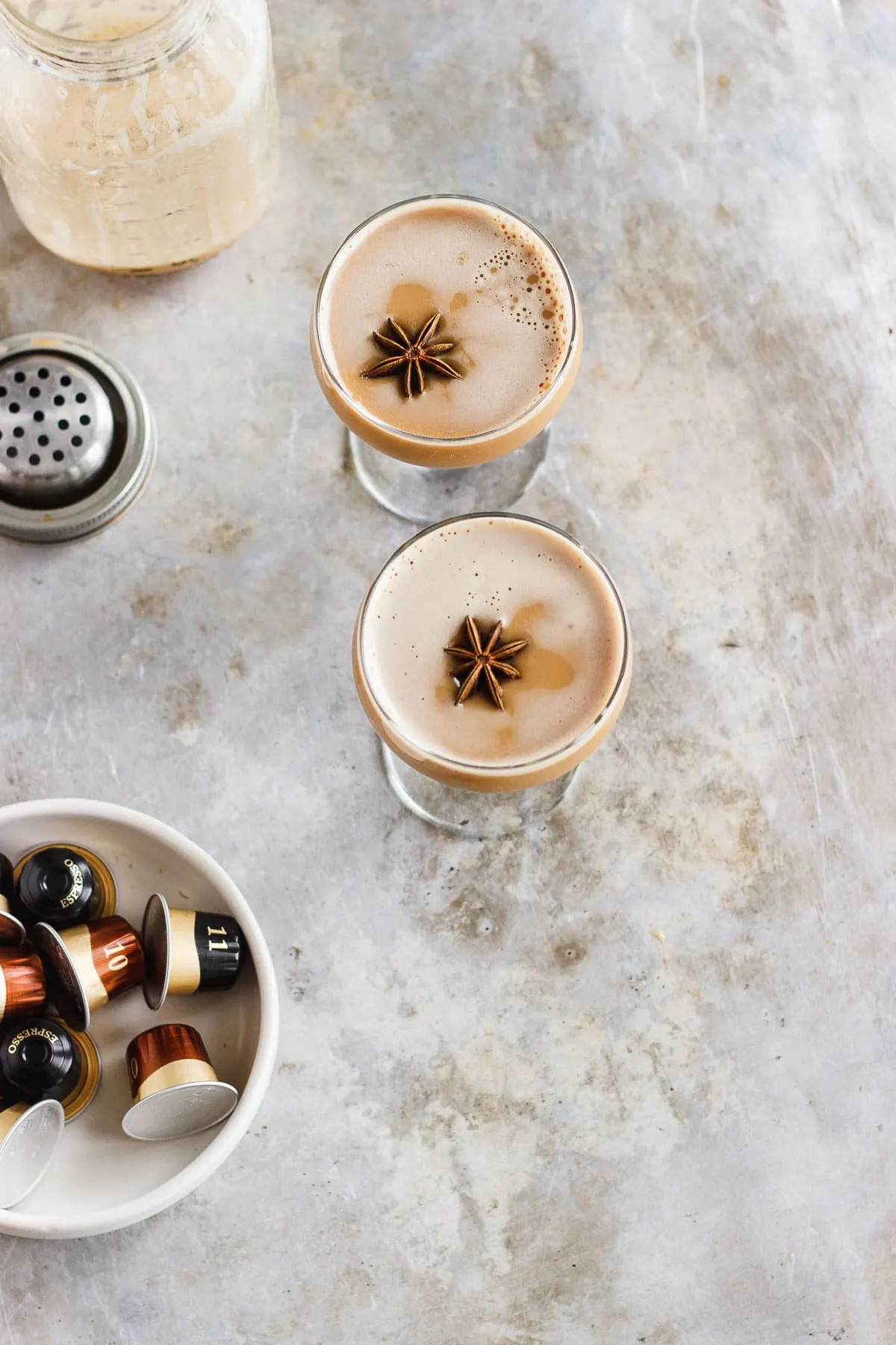 A dirty chai martini naturally sweetened with maple and balanced with a pinch of pink Himalayan salt. Made creamy with almond milk for a vegan cocktail. #dirtychaimartini #dirtychai #espressomartini