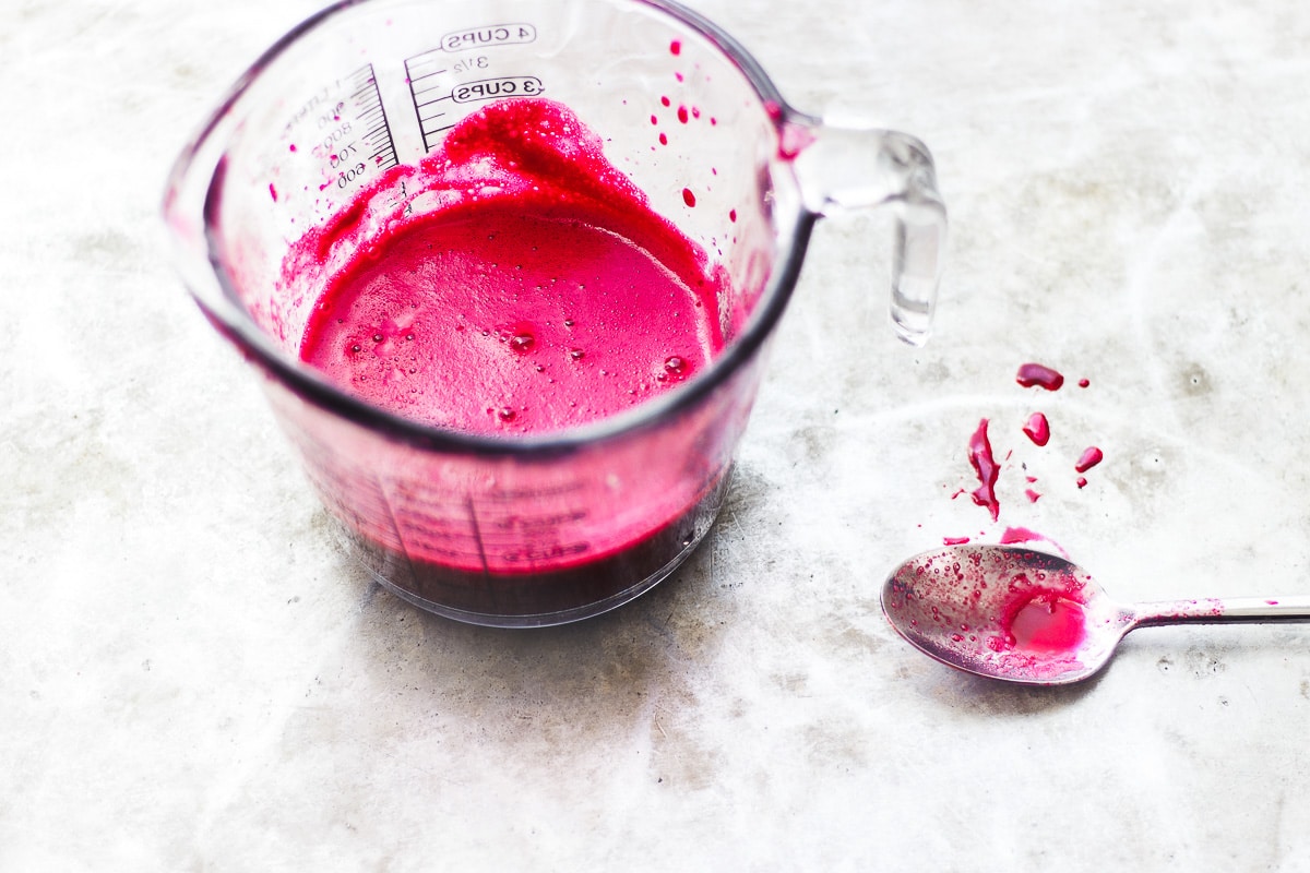 dark pink juice in a glass jar