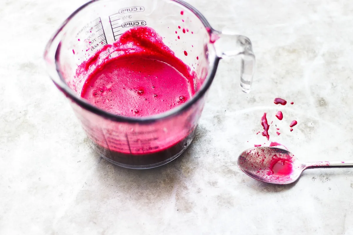 dark pink juice in a glass jar