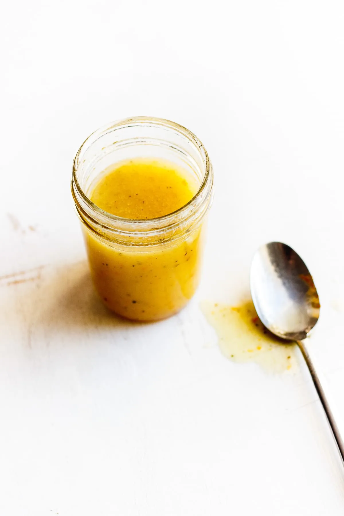 orange vinaigrette in a glass jar