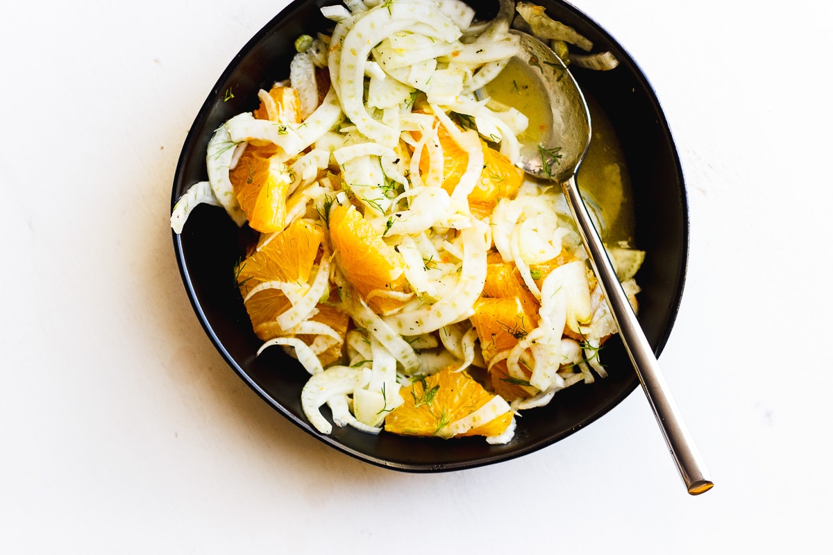 fennel and orange salad in black bowl