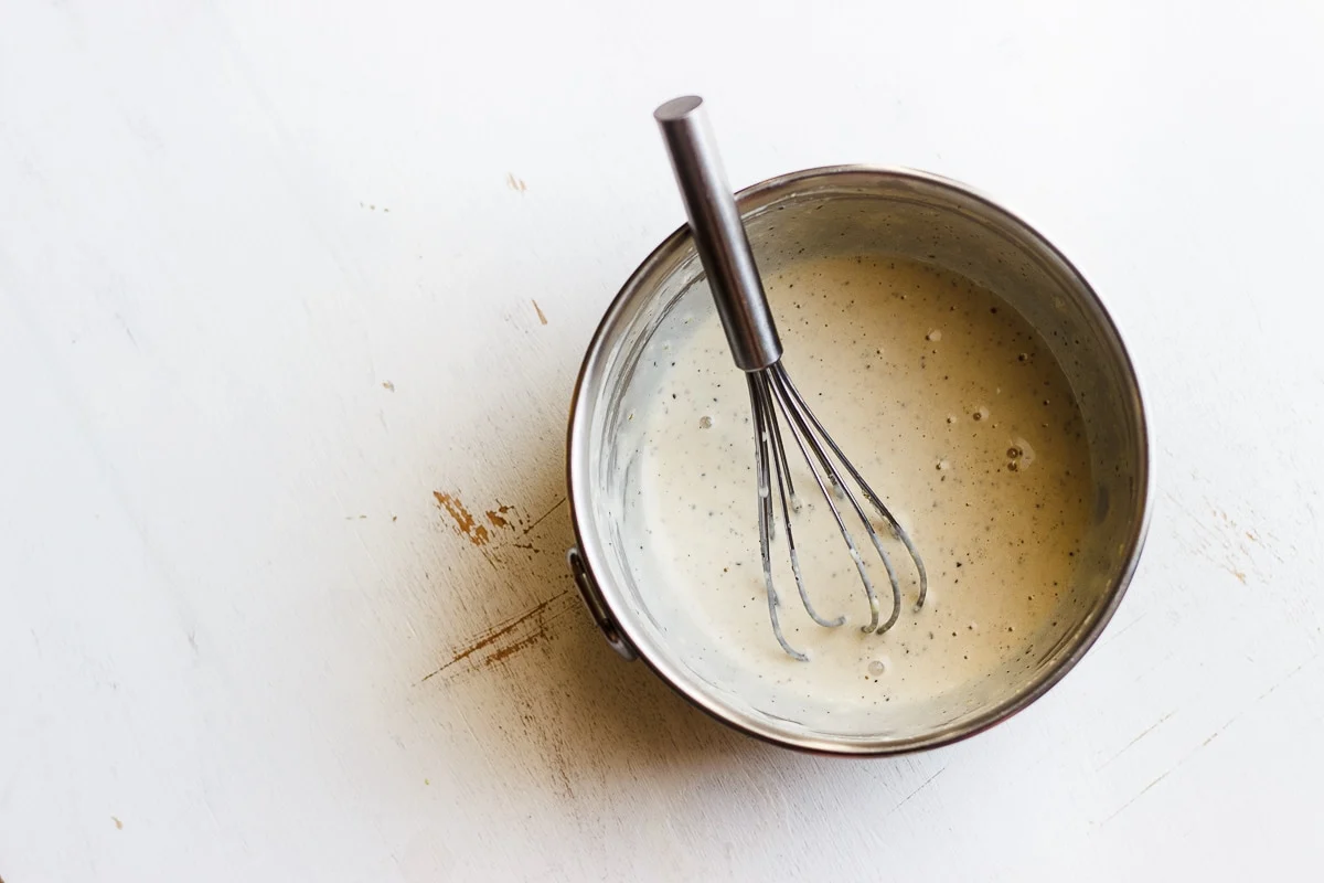 tahini sauce with a whisk